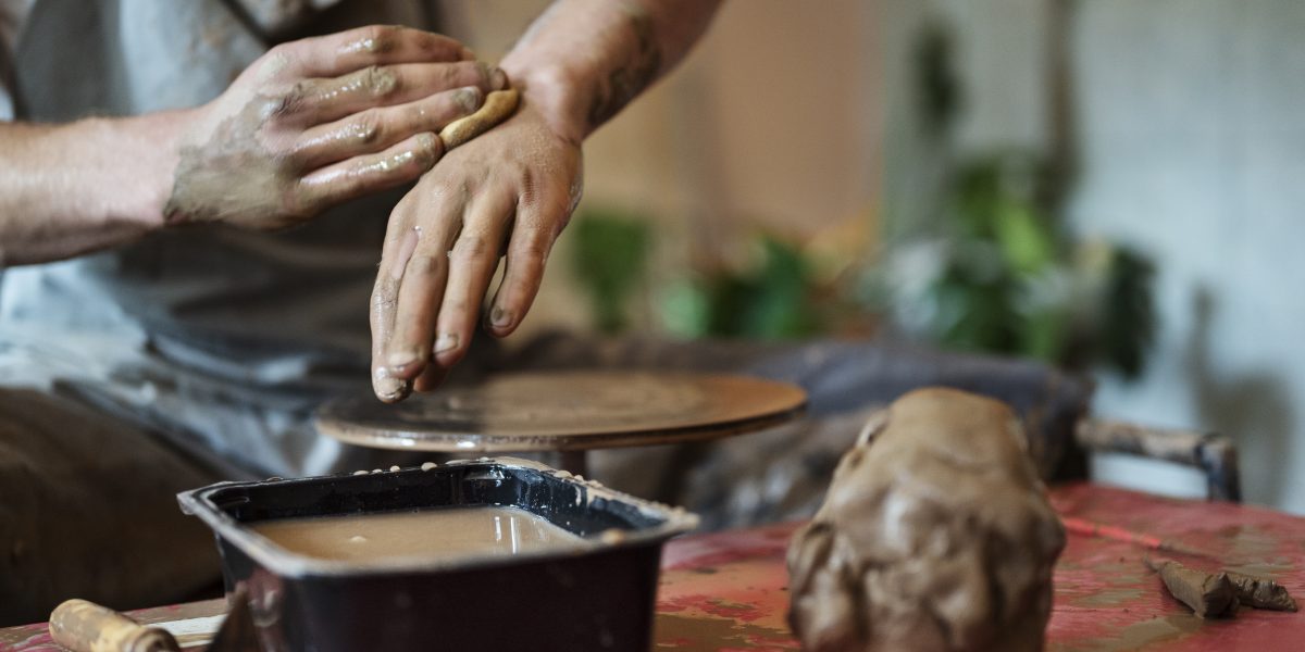 front-view-man-working-with-clay